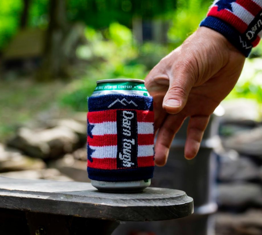 Our Limited Edition Captain Coozie snuggled around a beverage being enjoyed outdoors by some happy American.