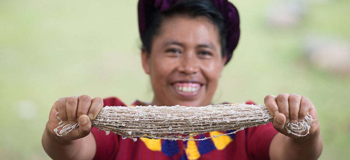 Guatemalan weaver, Mayra Hernandez, with her son Gabriel