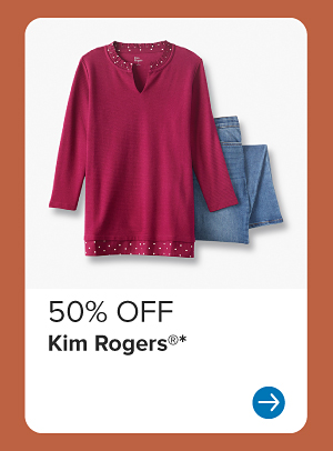 A burgundy top and jeans. 50% off Kim Rogers.