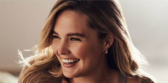 Happy woman wearing Le Vian jewelry