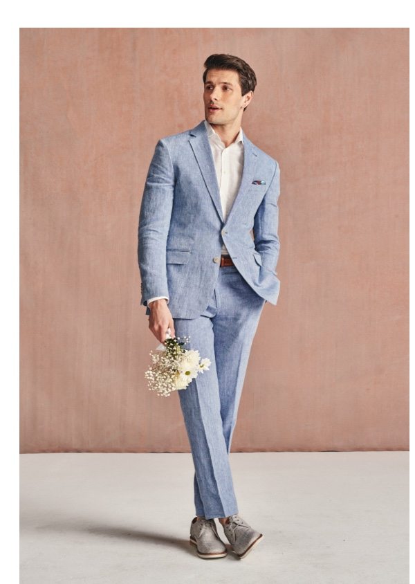 Man in light blue linen suit