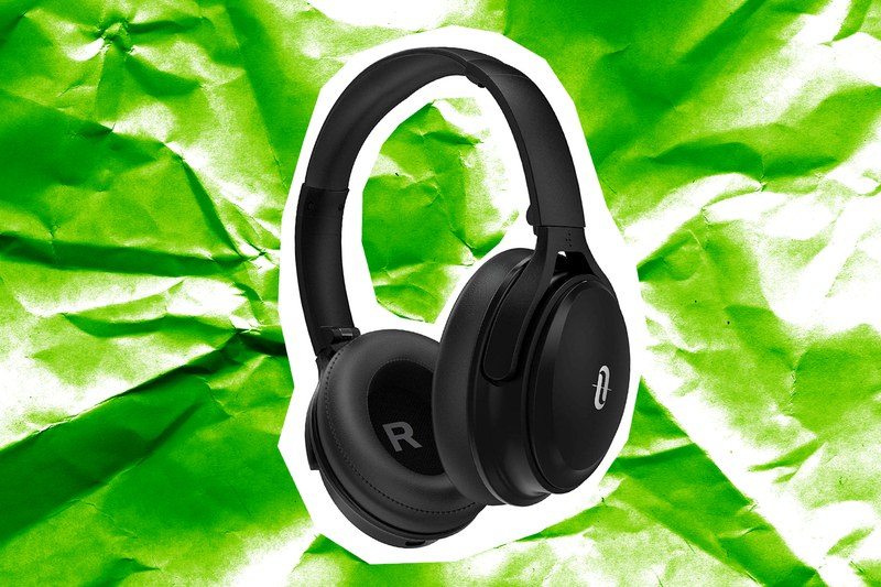 A pair of headphones on a green paper background