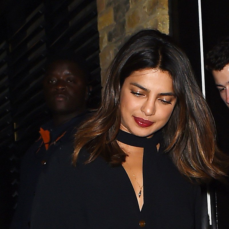 Priyanka Chopra pairs a glowing complexion with a berried lip.