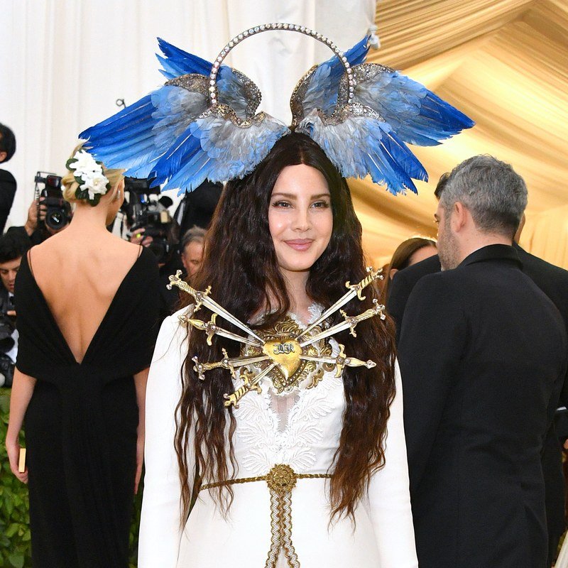 Lana Del Rey in a Gucci gown and a winged headpiece at the 2018 Met Gala