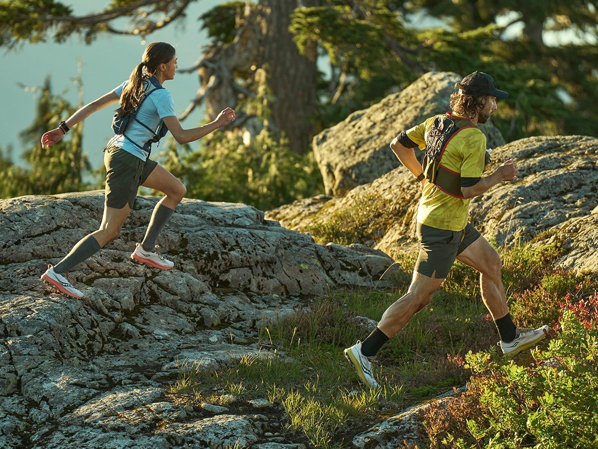 two runners on the trail wearing the saucony peregrine 13