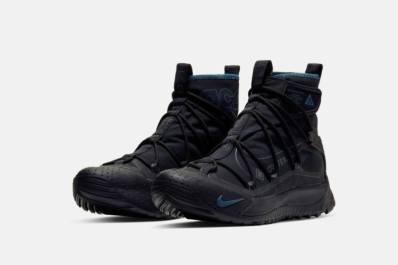black winter sneakers in a white studio