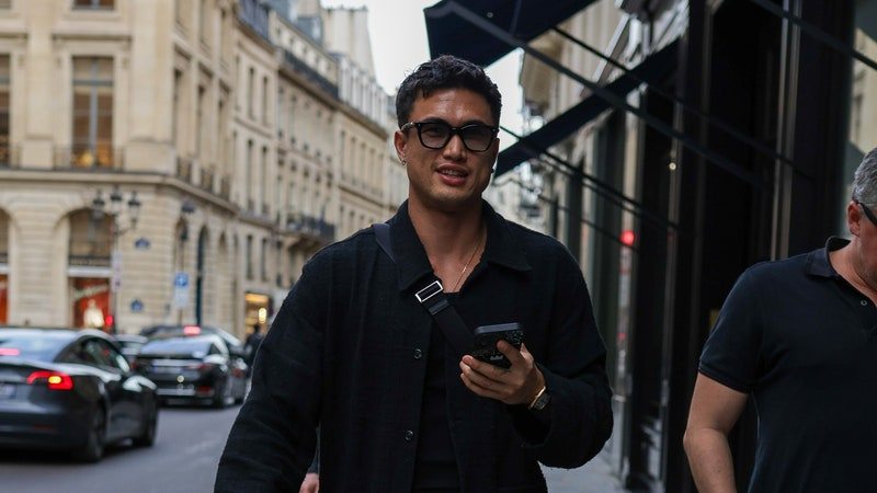 Image may contain: Charles Melton, Clothing, Pants, City, Road, Street, Urban, Jeans, Adult, Person, Accessories, and Glasses