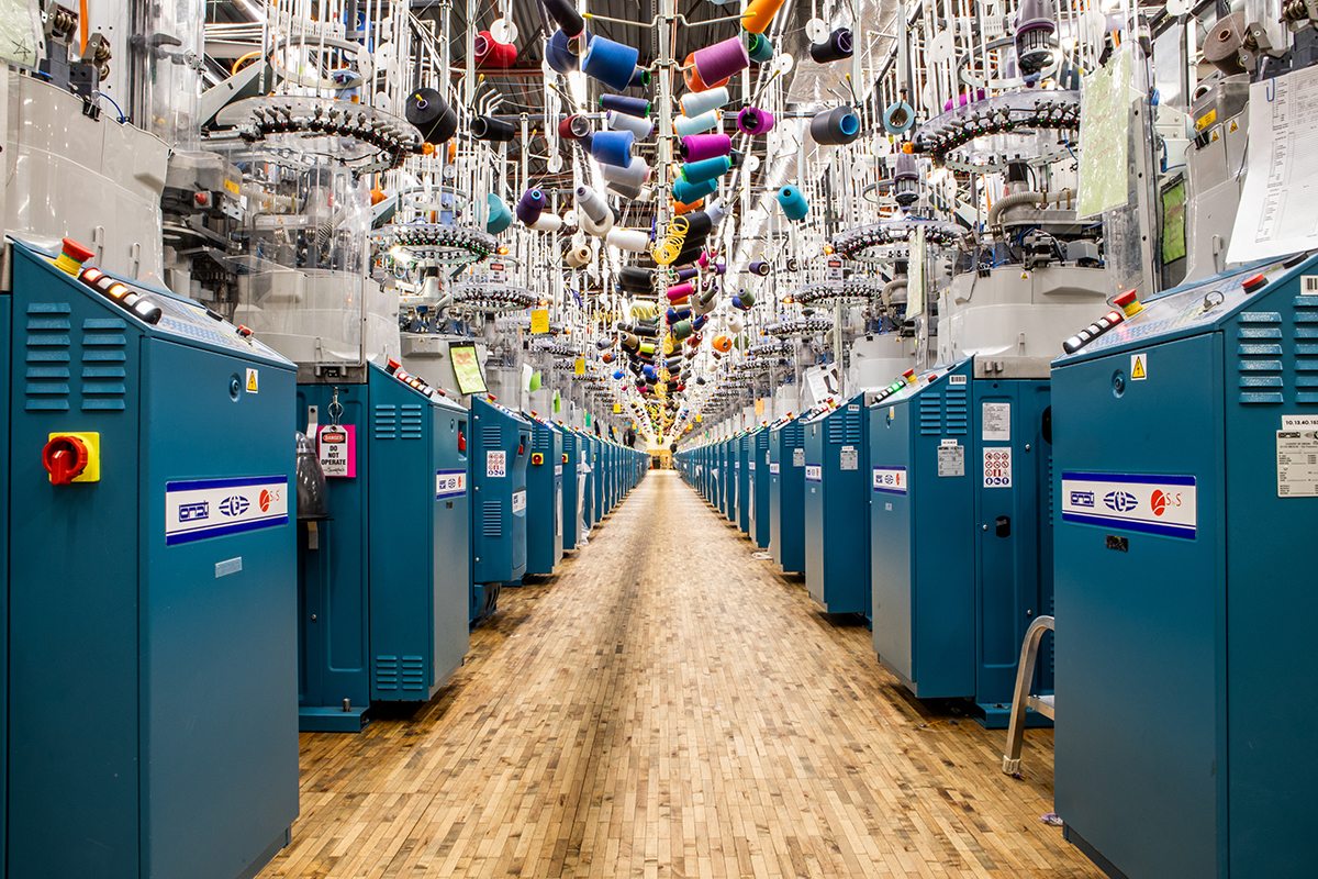 Knitting machines in aisle at the Mill