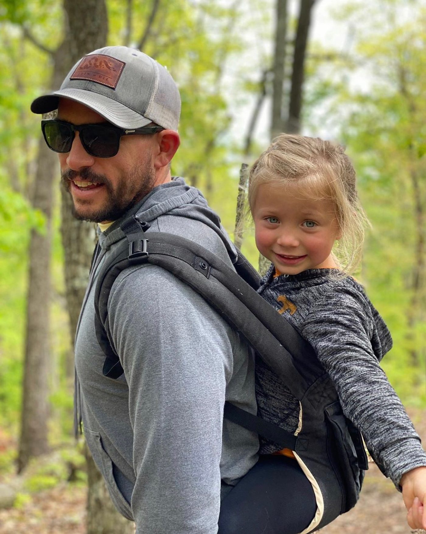 man sunglasses and daughter hiking