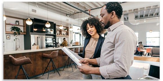 Two people reviewing documents