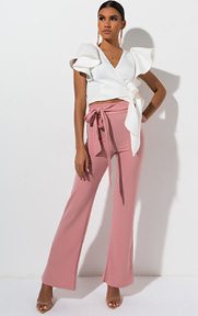 Wrap Me Up Tie Front Crop Top is a scuba knit based blouse complete with ruffled short sleeves, a tie front belt, wrap front neckline and cropped hem.