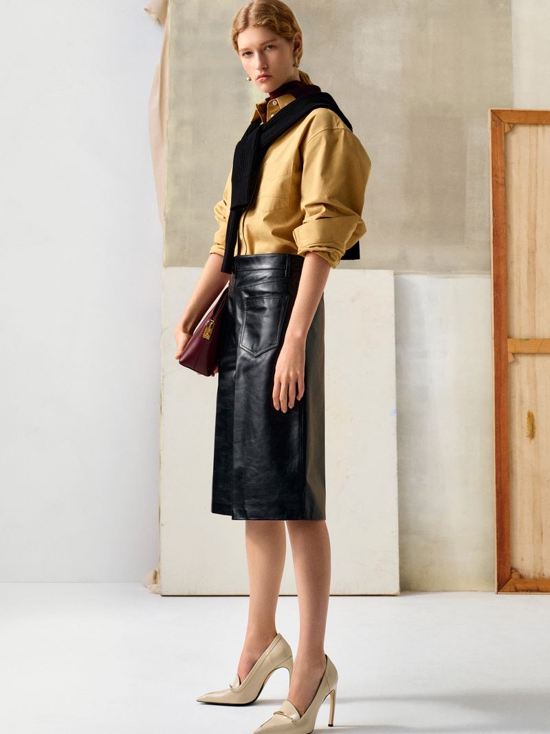 This shin-grazing skirt style has the street style seal of approval.