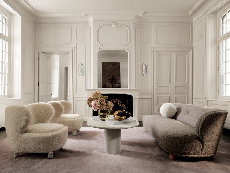 Image may contain: Home Decor, Furniture, Architecture, Building, Indoors, Living Room, Room, Table, and Interior Design