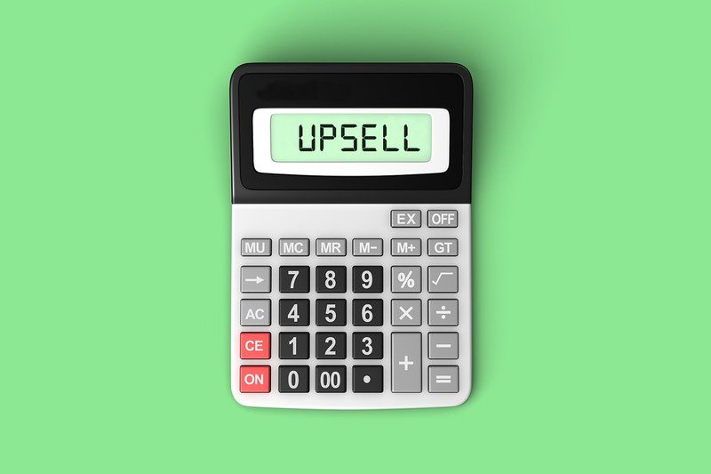 A calculator with the word %22UPSELL%22 typed on screen