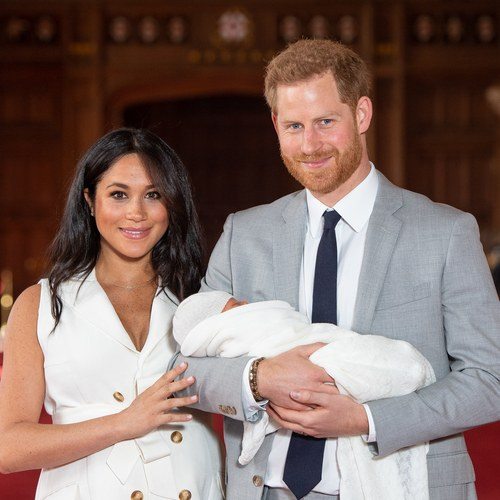 Prince Harry, Duke of Sussex and Meghan Markle pose with their newborn son Archie Harrison Mountbatten-Windsor