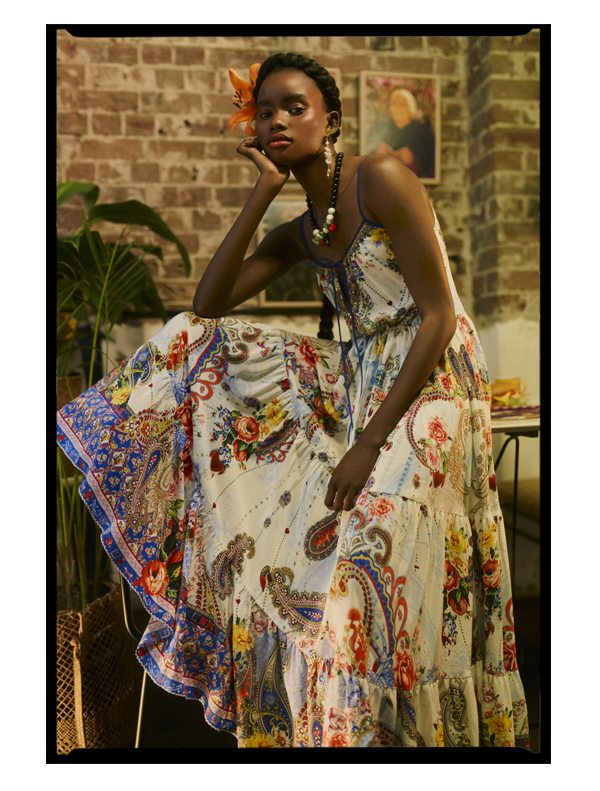 Model wearing blue, yellow and red printed maxi dress.