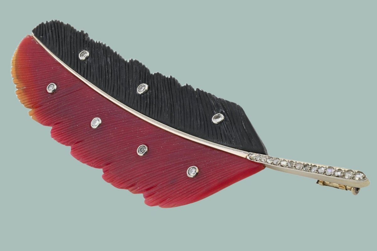 This Intricately Carved Feather Brooch Is a Work of Art