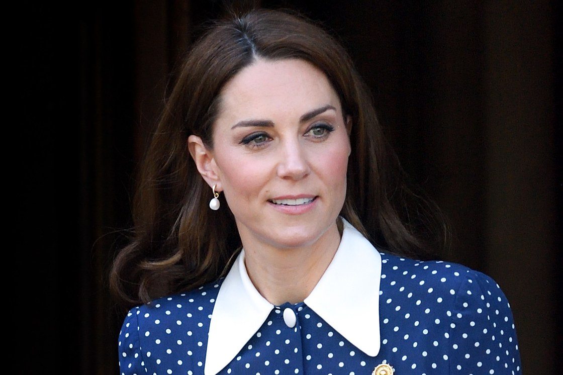 Kate Middleton wears a blue dress with white polka dots
