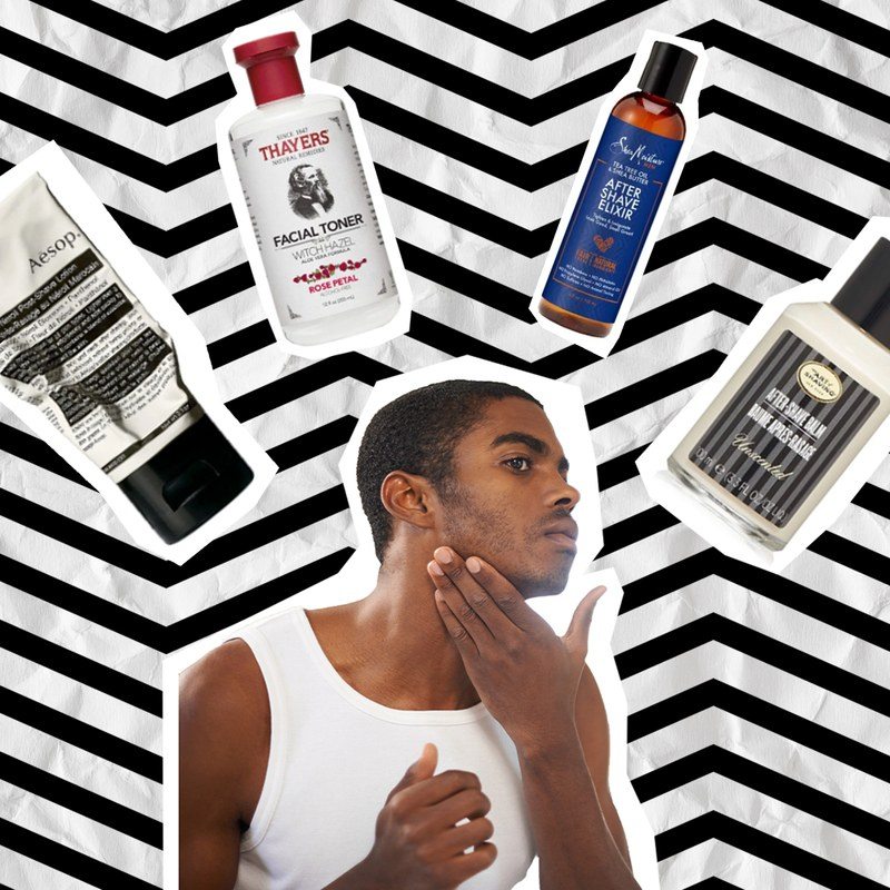 Guy touching face with after shave products in background