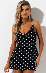 The AKIRA Label Flirty Girl Polka Dot Mini Dress is a sweet and flirty party dress complete with a retro inspired polka dot pattern, flattering sweetheart neckline, concealed back zipper and leg baring mini hem.
