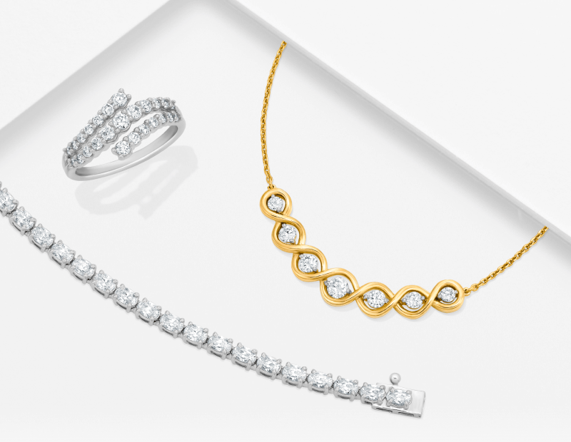 An Assortment of stunning jewelry - A golden chain, diamond ring and diamond bracelet.