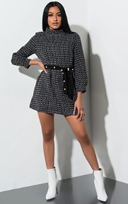 All Dolled Up Tweed Mini Dress is a thick knit, tweed based dress complete with long bell sleeves, a high mock neck collar, concealed back zipper and contrasting faux suede, pearl embellished belt to help cinch the waist.