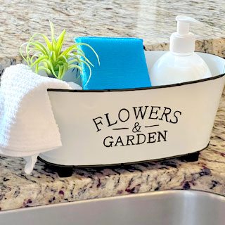 Flowers & Garden white metal tub with sponge, towel, and soap in it