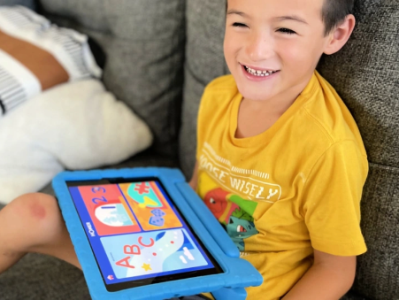 Child with a tablet using Homer's Learning App
