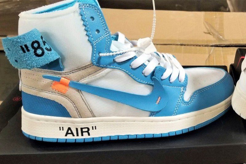 two fake nike sneakers