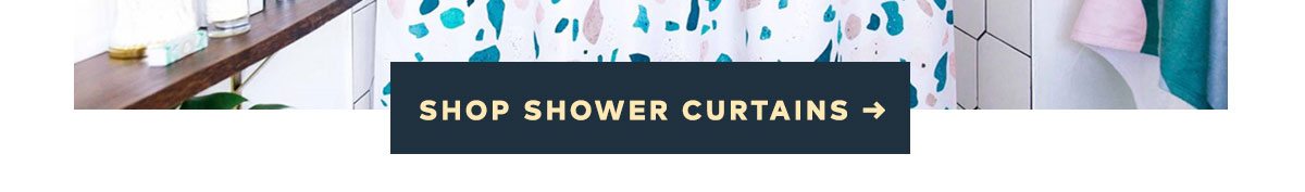 The solution to a blah bathroom. SHOP SHOWER CURTAINS >