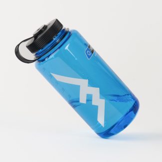 Free Sticker with orders $75+ - a white mountain sticker stuck on a blue Nalgene bottle