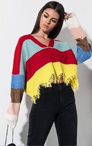 Label Flirty and Fine Color Block Sweater is a long sleeved, chunky knit sweater complete with a color block, striped design, fringe heep and a v-shaped neckline.