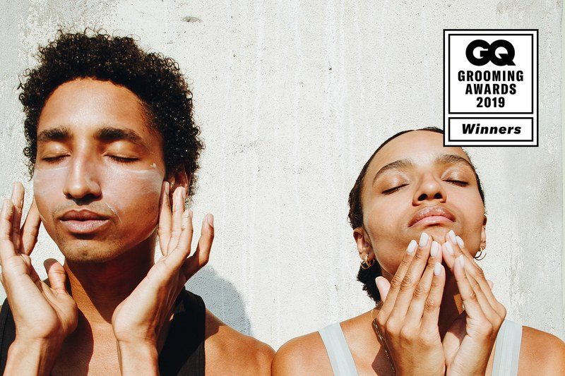 two models put on moisturizer